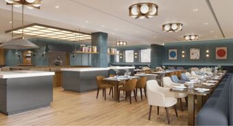 Dining area with wooden tables, assorted chairs, decorative flowers, pendant lighting, and kitchen space at Tivoli Tivoli President Milano Hotel