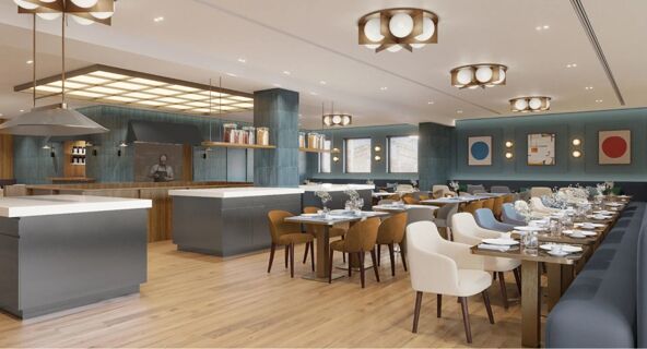 Dining area with wooden tables, assorted chairs, decorative flowers, pendant lighting, and kitchen space at Tivoli Tivoli President Milano Hotel