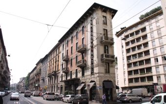 Tall narrow building with a vertical sign reading Demidoff Hotel on a busy city street near Casual Eclettico Milano Hotel