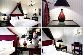 Alt N&uuml;rnberg Hotel 內優雅舒適的臥室，配有雙人床、床頭桌、裝飾燈和插花。