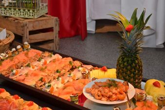 Assorted shrimp, smoked salmon, rolled appetizers, pineapple decorated with strawberries served at Rh&ouml;ngasthof Zur Linde & Ferien-Appartements Rh&ouml;nsicht