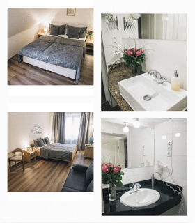 Gem&uuml;tliche Zimmer und moderne Badezimmer mit Blumenarrangements im Marktplatzhotel u. Bistrorant Tafelspitz f&uuml;r erholsamen Aufenthalt.