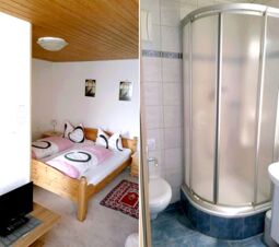 Gem&uuml;tliches Schlafzimmer mit Holzdecke und angrenzendem Badezimmer mit abgerundeter Duschkabine in der Pension Arnold.