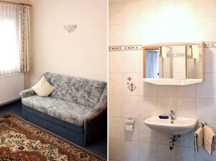 Living area with a patterned sofa and a bathroom featuring a wall-mounted sink and mirror cabinet at Pension Graml Fr&uuml;hst&uuml;ckspension