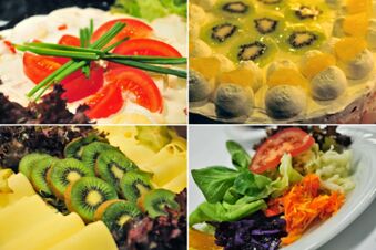 Close-up of various dishes with sliced tomatoes, kiwi, cheese, salad, and a fruit dessert at Akzent Hotel Stadt Schl&uuml;chtern