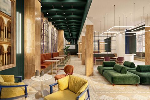 Interior of B&B Hotel Milano Duomo Velasca with green velvet sofas, yellow and orange chairs, tables, wooden columns, and modern ceiling lights