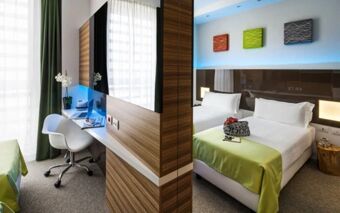 Modern hotel room at Hotel degli Arcimboldi with twin beds, green bed covers, wall art, desk area, and chair
